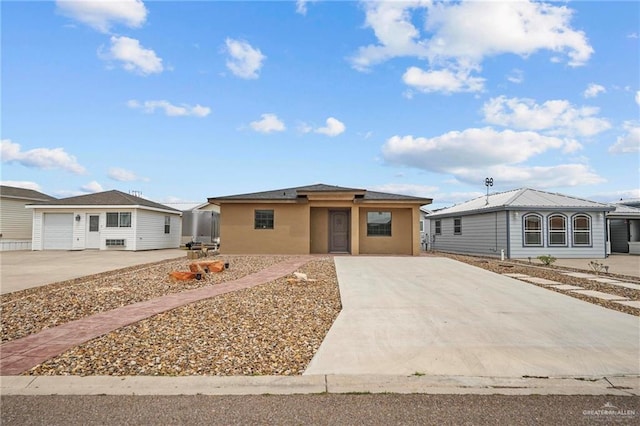2005 E Bogey Dr, Mission, TX 78572 - view of front of property featuring concrete driveway and stucco siding
