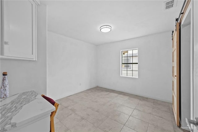 2005 E Bogey Dr, Mission, TX 78572 - unfurnished bedroom with a barn door