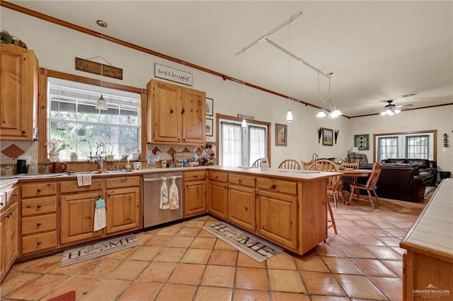 2724 Wildwood Dr, Weslaco, TX 78596 - kitchen with dishwasher, a peninsula, decorative light fixtures, tasteful backsplash, and ornamental molding