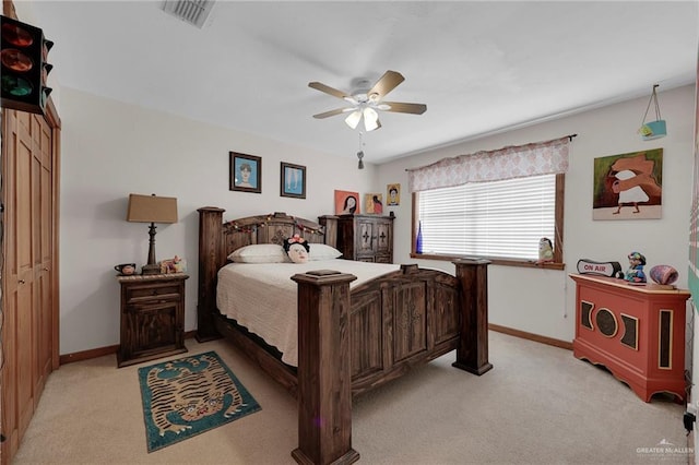 2724 Wildwood Dr, Weslaco, TX 78596 - bedroom with light carpet, baseboards, and a ceiling fan