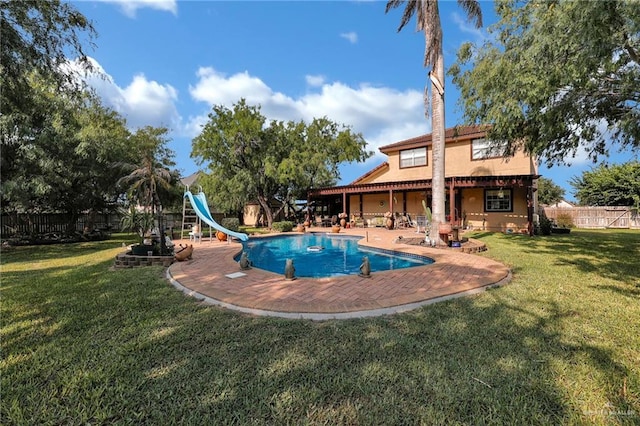 2724 Wildwood Dr, Weslaco, TX 78596 - view of swimming pool with a water slide and a patio