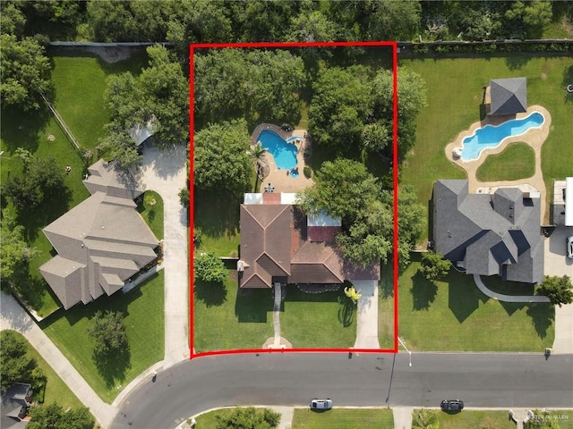 2724 Wildwood Dr, Weslaco, TX 78596 - aerial overview of property's location featuring a pool and property boundaries highlighted