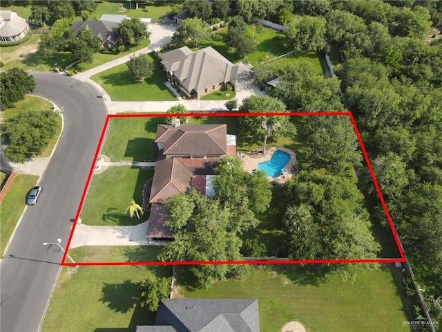 2724 Wildwood Dr, Weslaco, TX 78596 - aerial view of residential area featuring a pool area and property parcel outlined