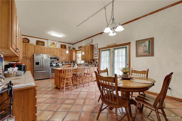 2724 Wildwood Dr, Weslaco, TX 78596 - dining area featuring ornamental molding