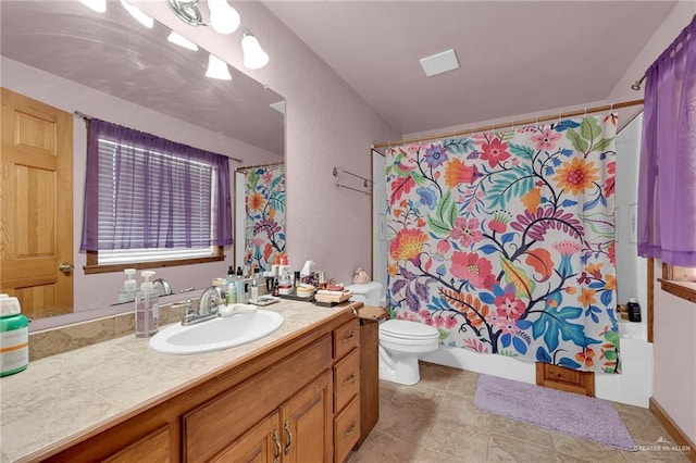 2724 Wildwood Dr, Weslaco, TX 78596 - full bath with vanity, toilet, shower / bath combo, and a textured wall