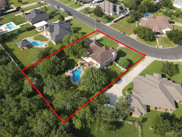 2724 Wildwood Dr, Weslaco, TX 78596 - aerial view of residential area with a pool and property boundaries highlighted