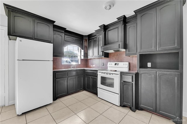 kitchen featuring decorative backsplash, light tile patterned floors, extractor fan, and white appliances