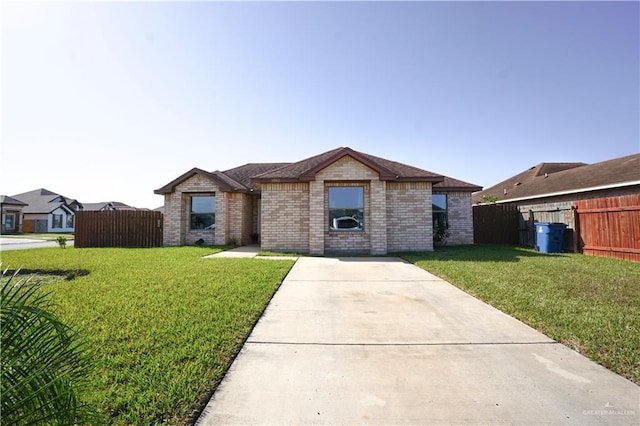 ranch-style home with a front yard