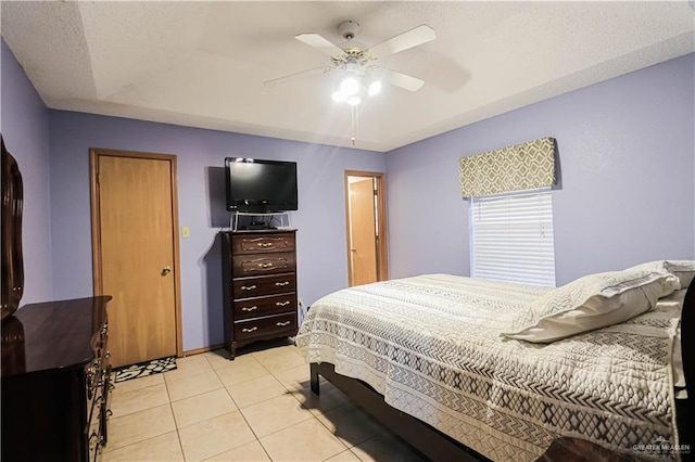 bedroom featuring ceiling fan and light tile patterned flooring