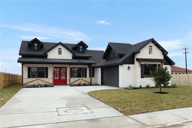 1201 Bette St, Pharr, TX 78577 - modern farmhouse style home featuring fence, a front lawn, french doors, and concrete driveway