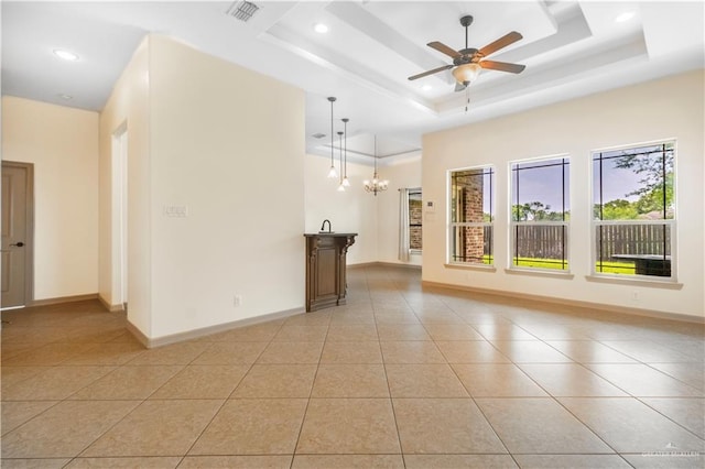 1704 Yellow Stone St, Edinburg, TX 78542 - unfurnished living room with light tile patterned floors, a raised ceiling, a chandelier, a ceiling fan, and recessed lighting