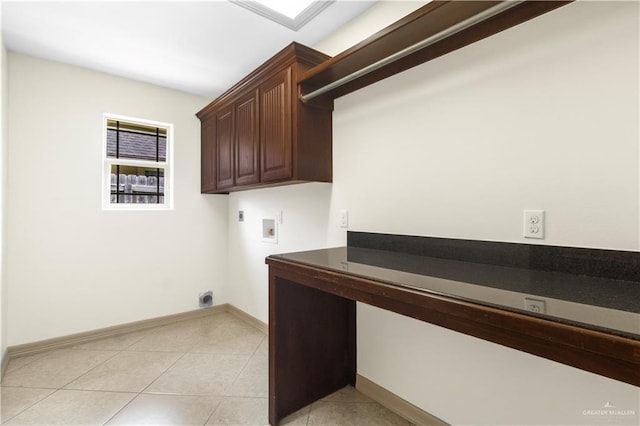 1704 Yellow Stone St, Edinburg, TX 78542 - washroom featuring hookup for an electric dryer, washer hookup, cabinet space, light tile patterned floors, and baseboards