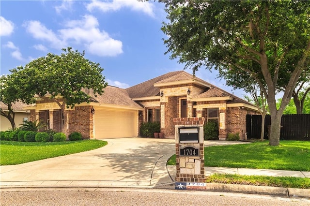 1704 Yellow Stone St, Edinburg, TX 78542 - view of front of house with brick siding, an attached garage, and driveway