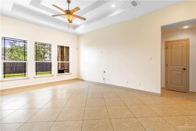 1704 Yellow Stone St, Edinburg, TX 78542 - unfurnished room featuring ceiling fan, light tile patterned floors, a tray ceiling, recessed lighting, and baseboards