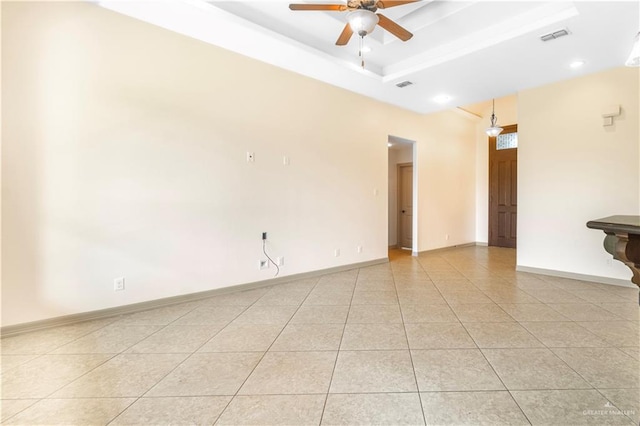 1704 Yellow Stone St, Edinburg, TX 78542 - spare room with a ceiling fan, light tile patterned floors, a raised ceiling, and baseboards