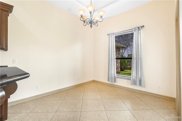 1704 Yellow Stone St, Edinburg, TX 78542 - unfurnished dining area with light tile patterned floors, a chandelier, and baseboards