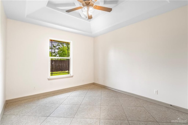 1704 Yellow Stone St, Edinburg, TX 78542 - unfurnished room featuring a raised ceiling, light tile patterned floors, baseboards, and ceiling fan