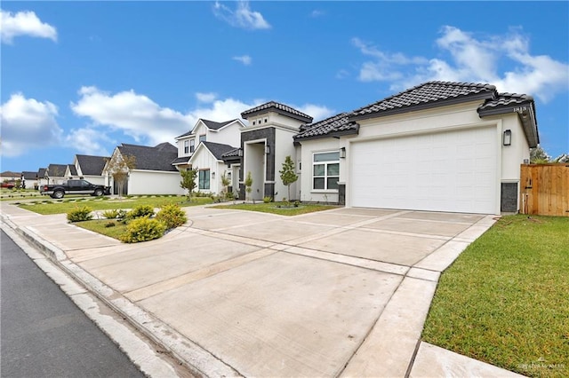 mediterranean / spanish home with a garage and a front yard