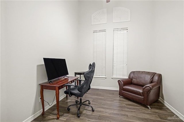 office featuring dark wood-type flooring and baseboards