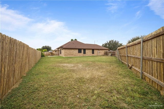 view of yard featuring a fenced backyard