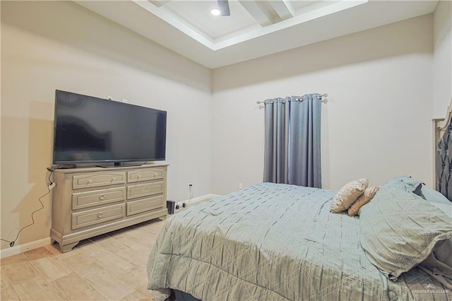 bedroom with light wood-type flooring, ceiling fan, and baseboards