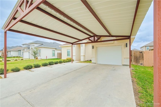 view of front of home with stucco siding, fence, a carport, a residential view, and a front lawn