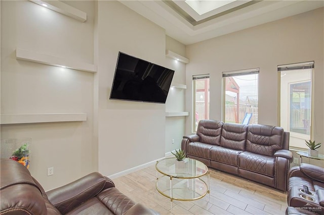 living room with baseboards and wood finished floors