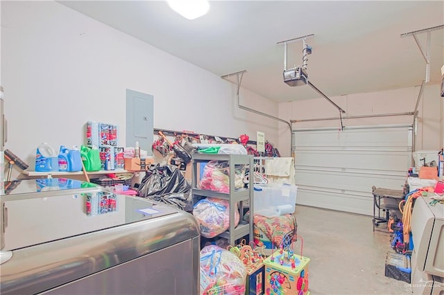 garage with washer / dryer, electric panel, and a garage door opener