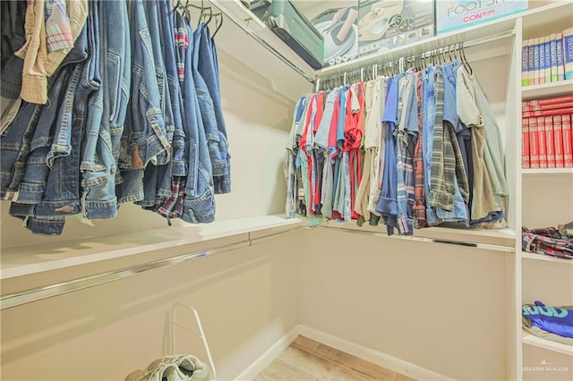 walk in closet featuring tile patterned flooring