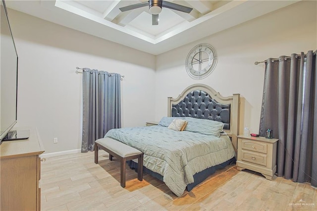 bedroom with a ceiling fan, light wood-type flooring, coffered ceiling, beamed ceiling, and baseboards