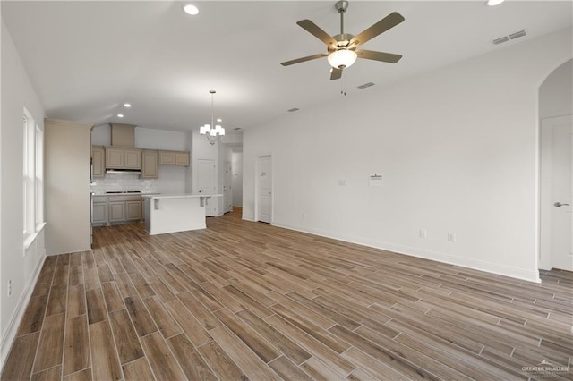 2206 Seagull Ln, Mission, TX 78572 - unfurnished living room with recessed lighting, light wood-type flooring, visible vents, and ceiling fan with notable chandelier