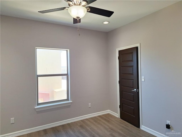 empty room with light hardwood / wood-style flooring and ceiling fan