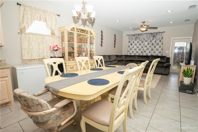 dining space featuring ceiling fan with notable chandelier, recessed lighting, visible vents, and light tile patterned floors