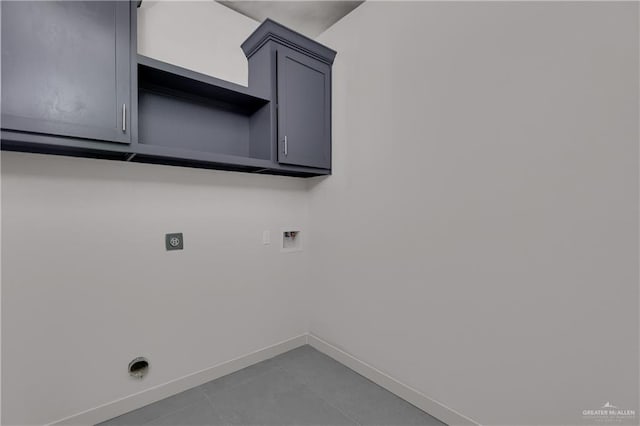 laundry area featuring washer hookup, cabinets, tile patterned flooring, and electric dryer hookup