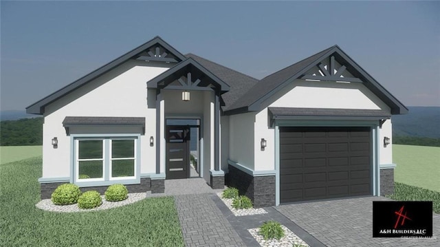 view of front of house featuring stone siding, decorative driveway, a front yard, and stucco siding