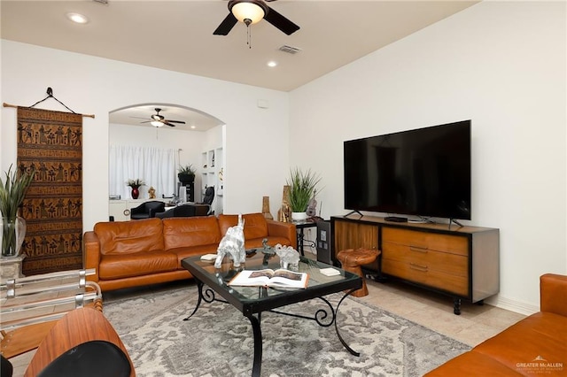 tiled living room featuring ceiling fan