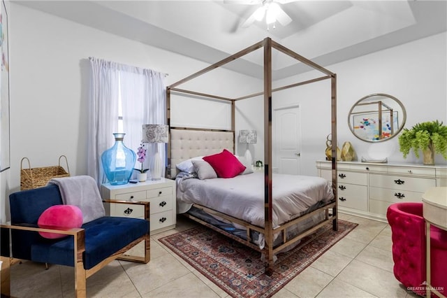 tiled bedroom featuring ceiling fan