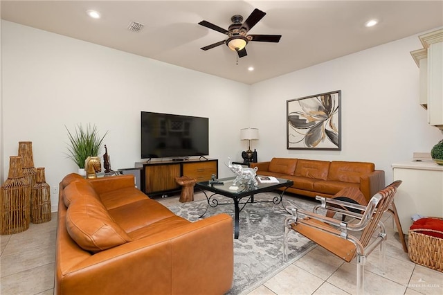 tiled living room with ceiling fan