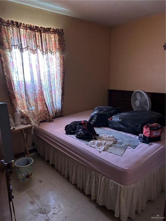 403 E San Benito St E Unit A, Rio Grande City, TX 78582 - bedroom with light tile patterned flooring