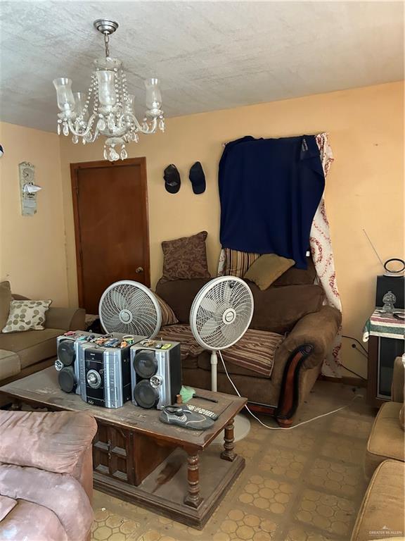 403 E San Benito St E Unit A, Rio Grande City, TX 78582 - living area with a chandelier