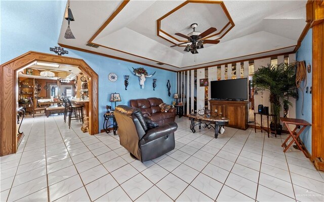34349 Fm 732nd Hwy, San Benito, TX 78586 - living room featuring light tile patterned floors, visible vents, a raised ceiling, and ceiling fan