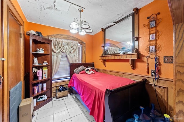 34349 Fm 732nd Hwy, San Benito, TX 78586 - bedroom featuring a notable chandelier and light tile patterned flooring