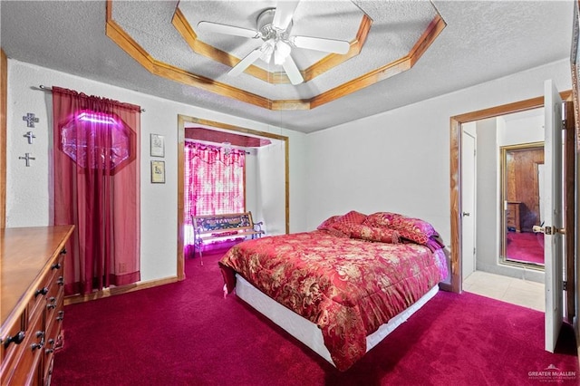 34349 Fm 732nd Hwy, San Benito, TX 78586 - bedroom featuring ceiling fan, a raised ceiling, carpet flooring, and a textured ceiling