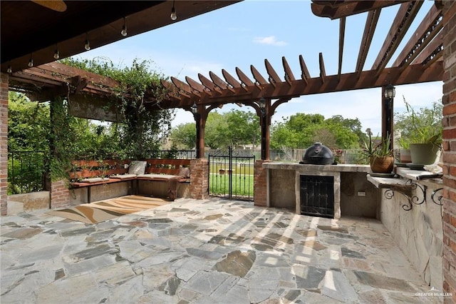 109 Palm Valley Cir, Harlingen, TX 78552 - view of patio / terrace featuring grilling area, a pergola, exterior kitchen, and fence