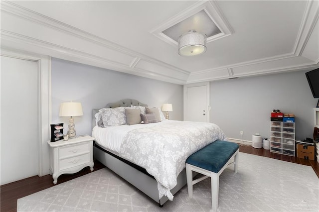 bedroom with light hardwood / wood-style flooring and crown molding