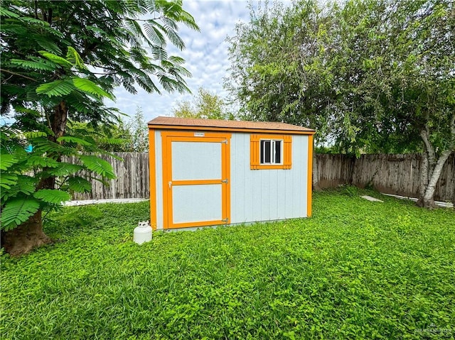 view of outbuilding featuring a yard