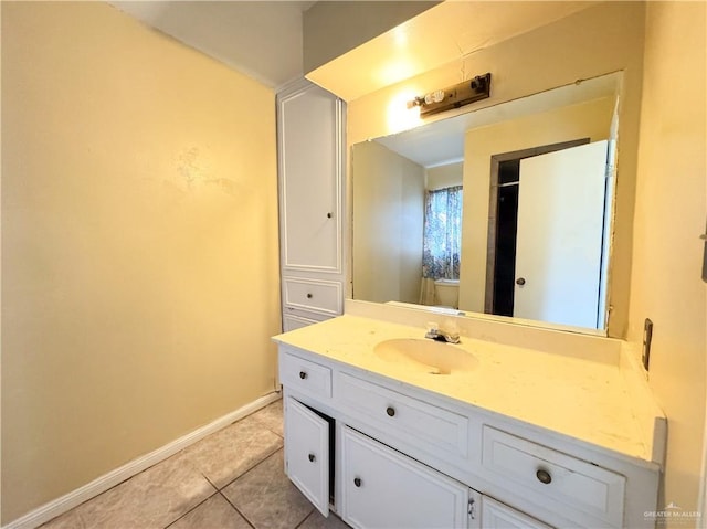 bathroom featuring tile patterned flooring, vanity, and toilet