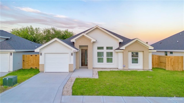 single story home with a yard and a garage