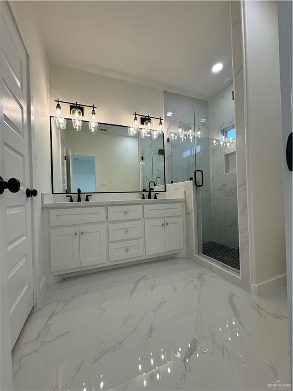 bathroom featuring vanity and a shower with shower door