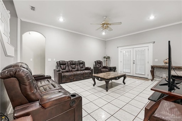 living room featuring crown molding, ceiling fan, french doors, and light tile patterned floors